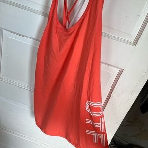 Orangetheory fitness salmon/coral colored shirt! Cute criss cross back.